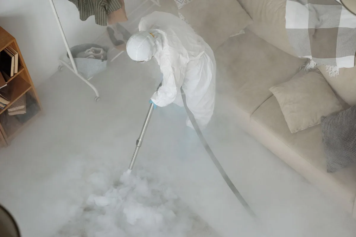 Biohazard cleanup technician in protective equipment, Au Gres, MI